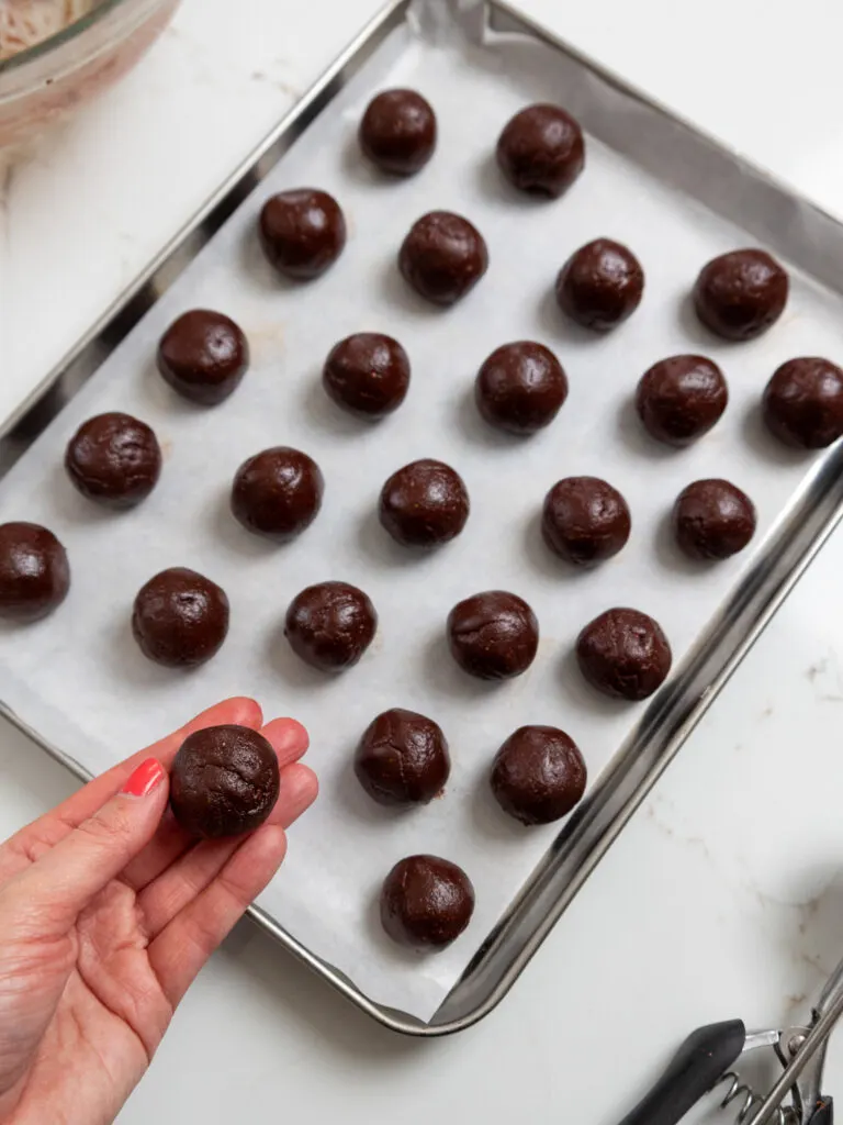 image of raspberry chocolate truffles being rolled out into balls