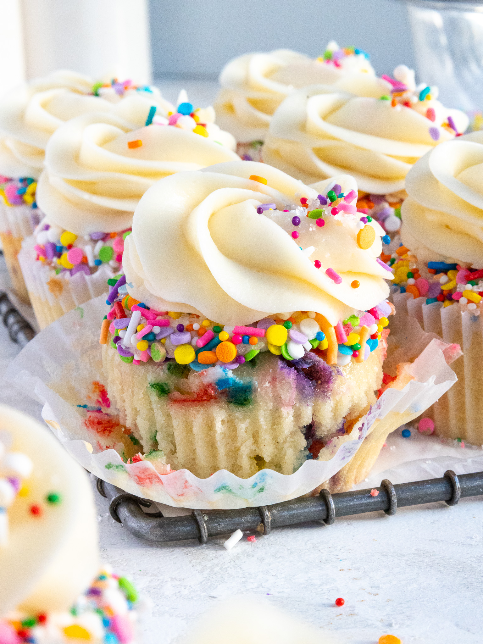 image of a cute funfetti cupcake that's been decorated with sprinkles