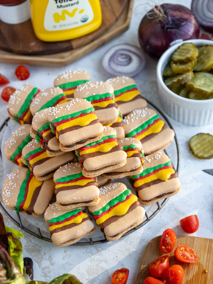 image of burger macarons stacked up in a pile