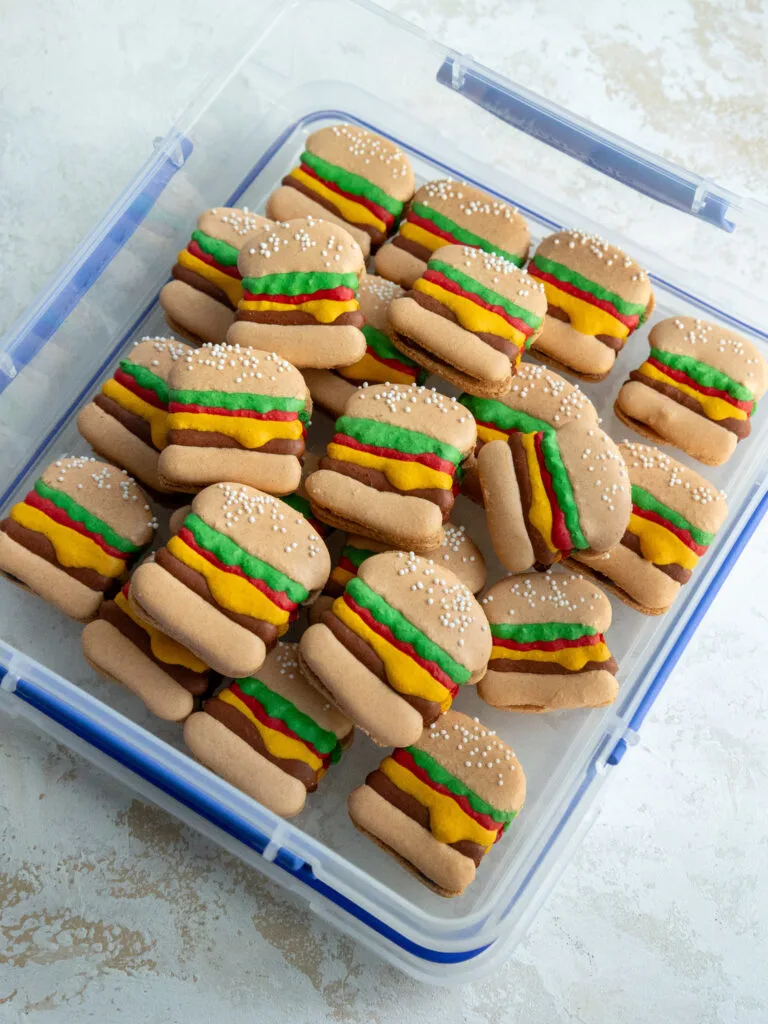 image of burger macarons in an airtight container