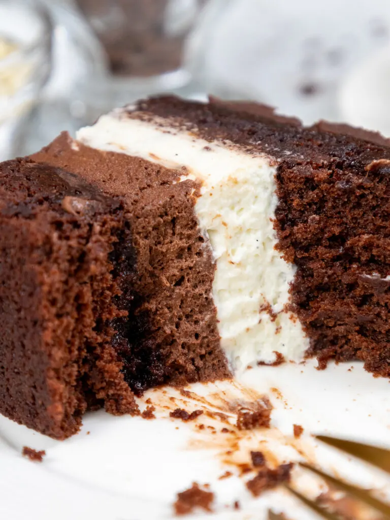 image of a slice of tuxedo cake that's been cut into to show how fluffy it's mousse filling is