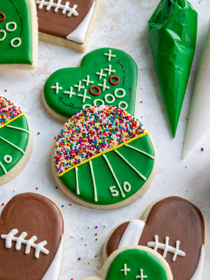image of a football field cookie decorated with sprinkles and royal icing
