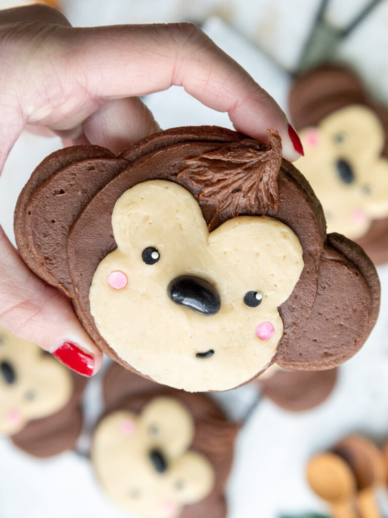 image of a cute monkey cookie decorated with buttercream frosting