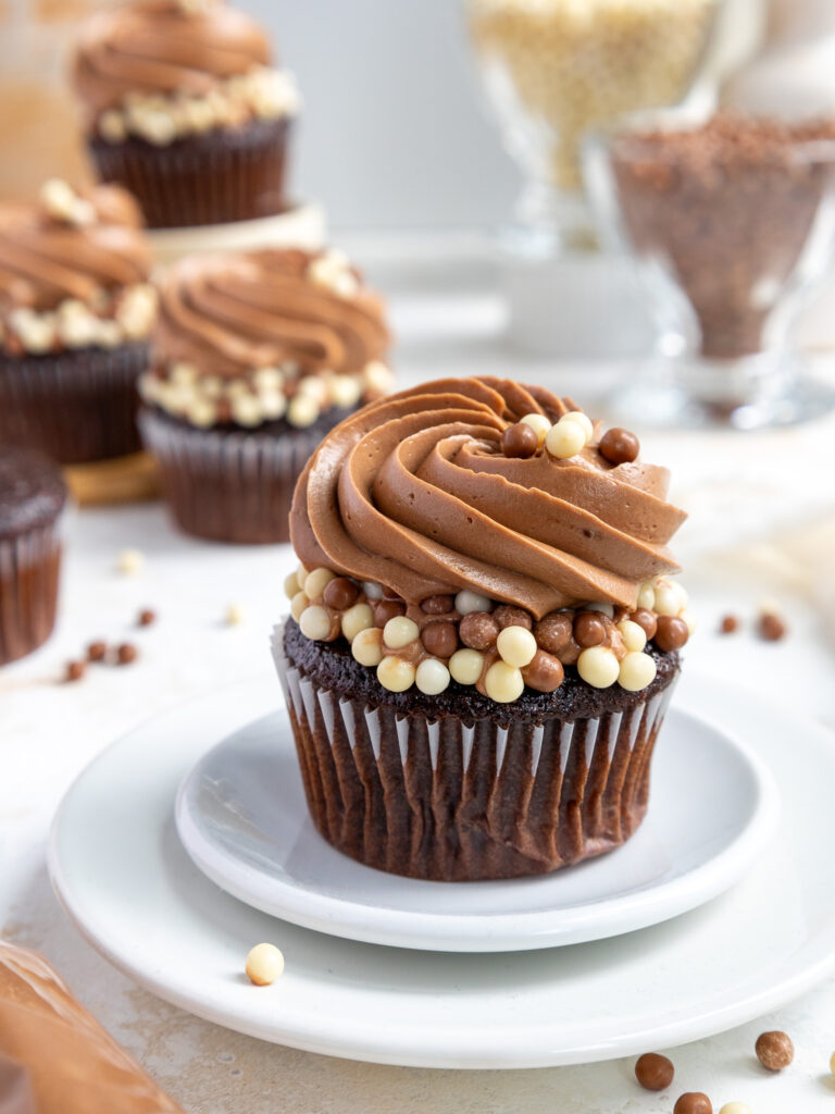 image of a chocolate cupcake frosted with not too sweet chocolate frosting