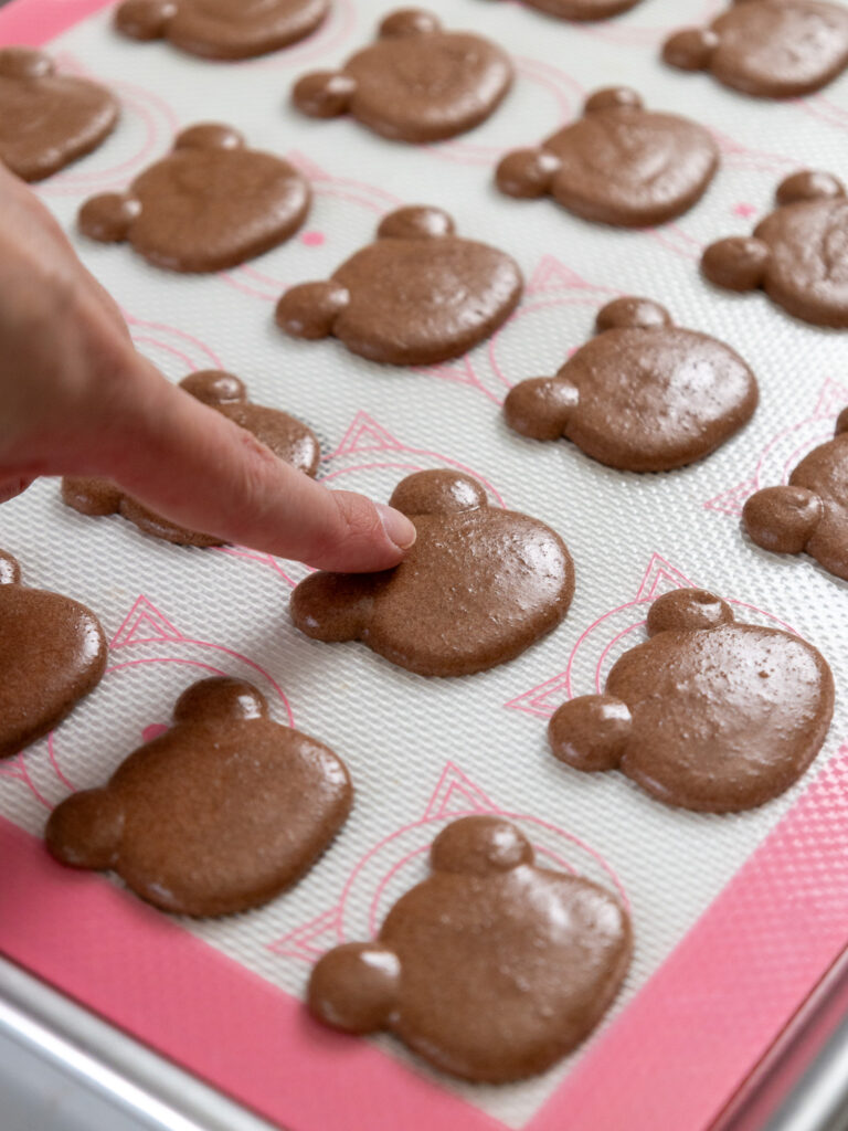 image of teddy bear macaron shells that have rested and have formed a skin which gives them a matte look