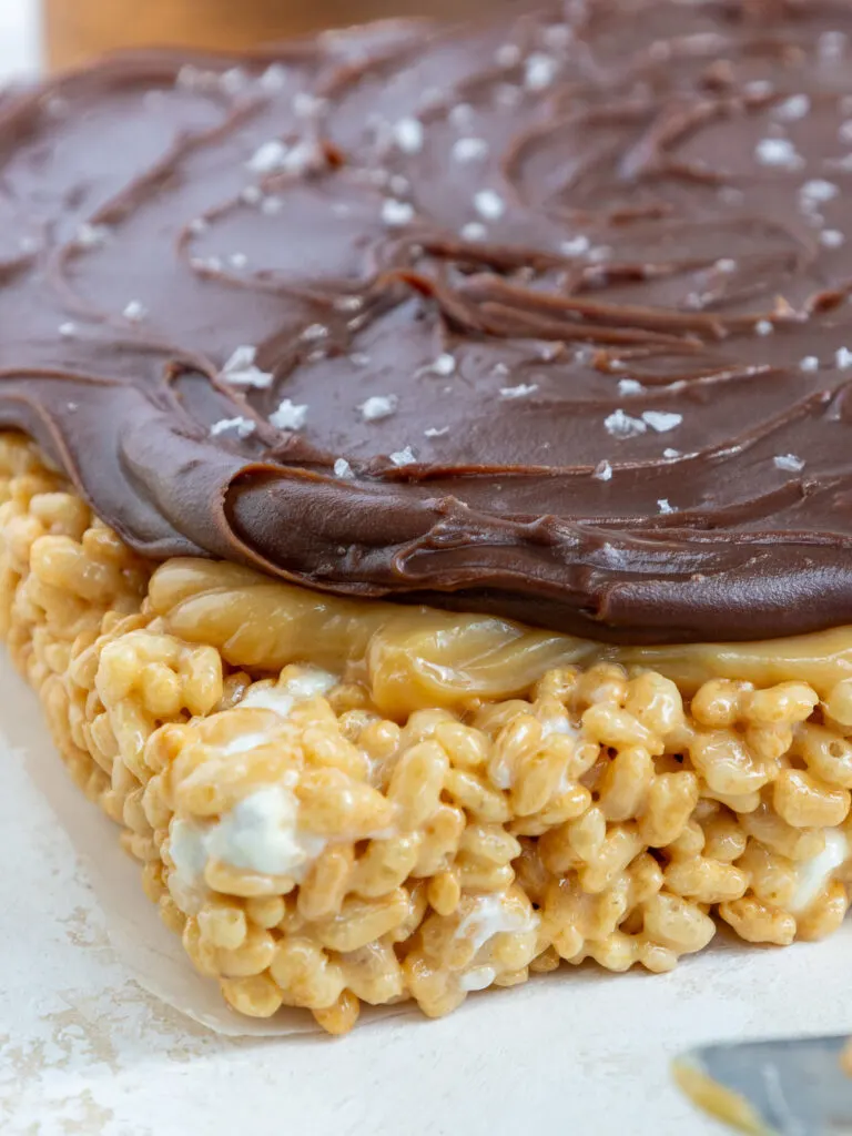 image of caramel chocolate rice krispies that are ready to be cut