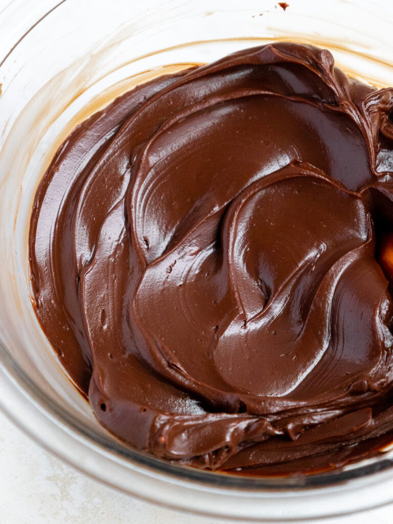 image of chocolate ganache frosting in a glass bowl