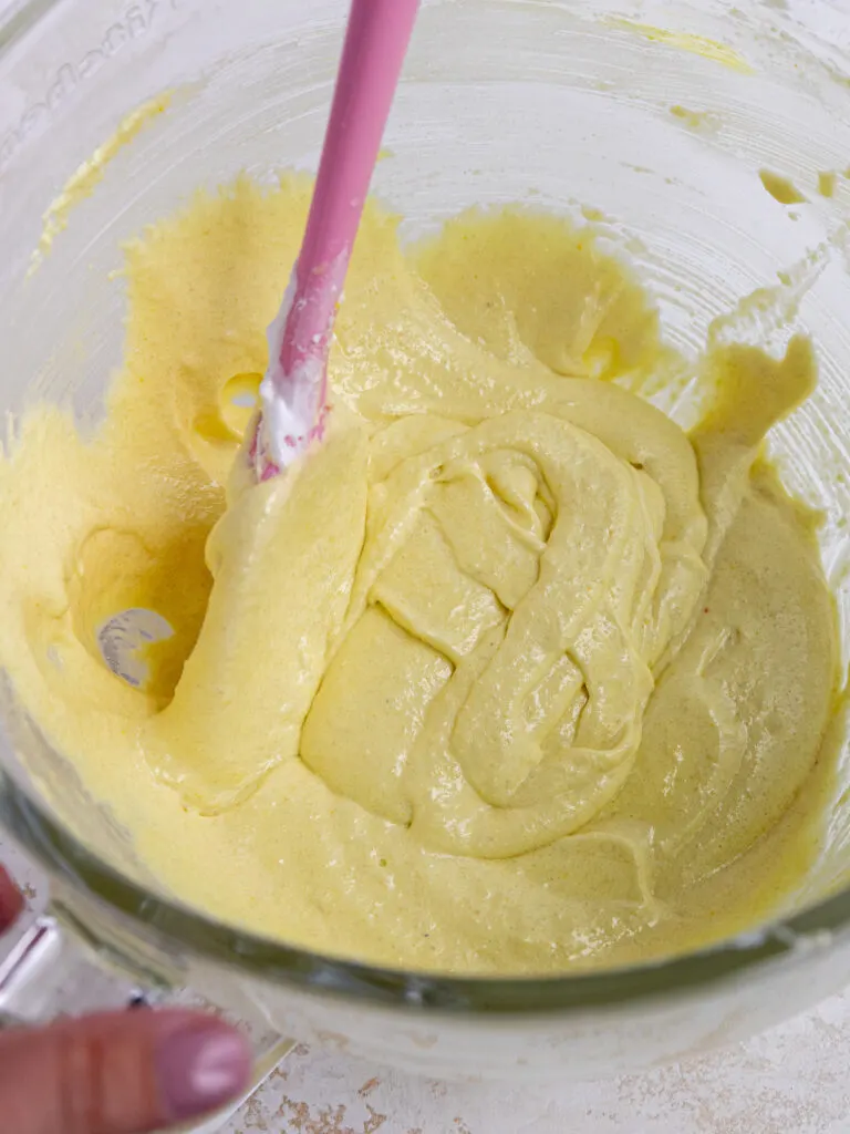 image of light yellow macaron batter that's been mixed the perfect amount and can be used to draw a few figure 8's