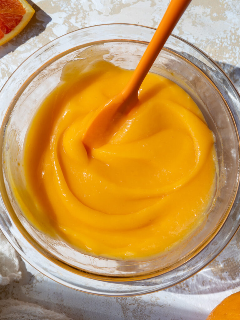 image of chilled orange curd in a glass bowl