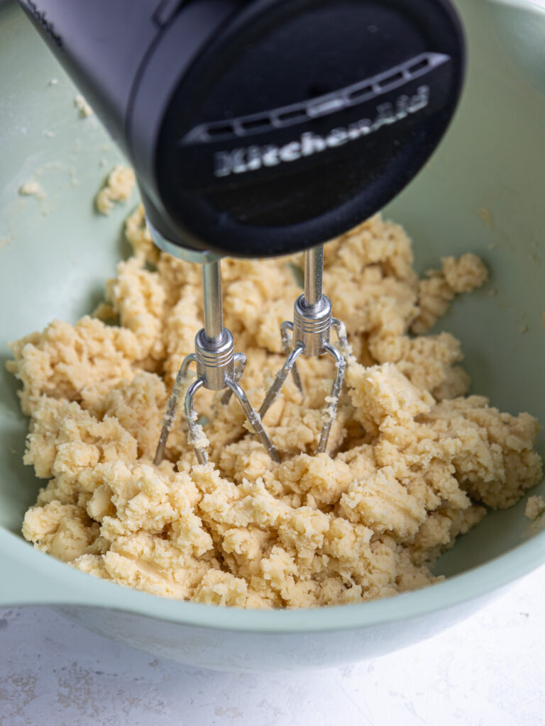 image of shortbread dough being mixed with an electric mixer