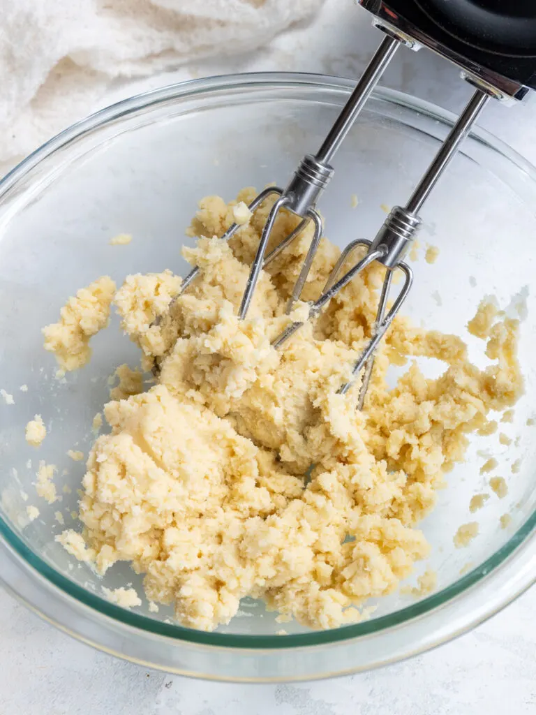 image of small batch shortbread cookie dough that's been mixed together in a glass bowl