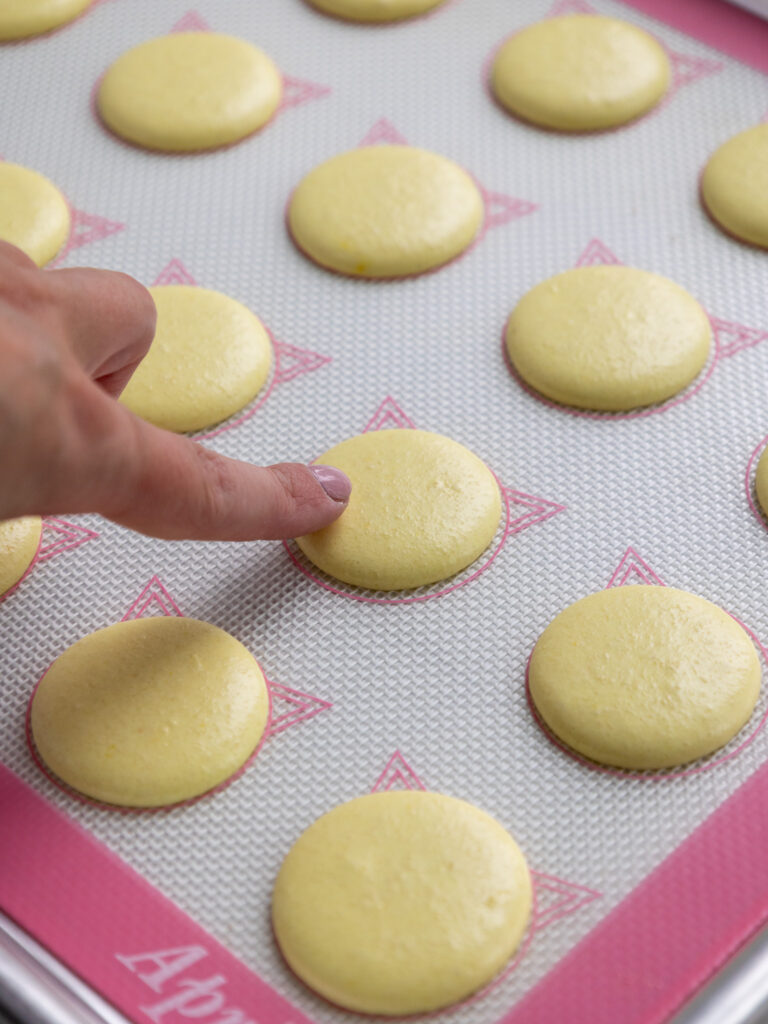 image of rested French macaron shells that have formed a skin and look matte