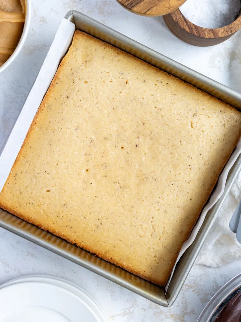 image of brown butter cake that's been baked and cooled in a square metal pan