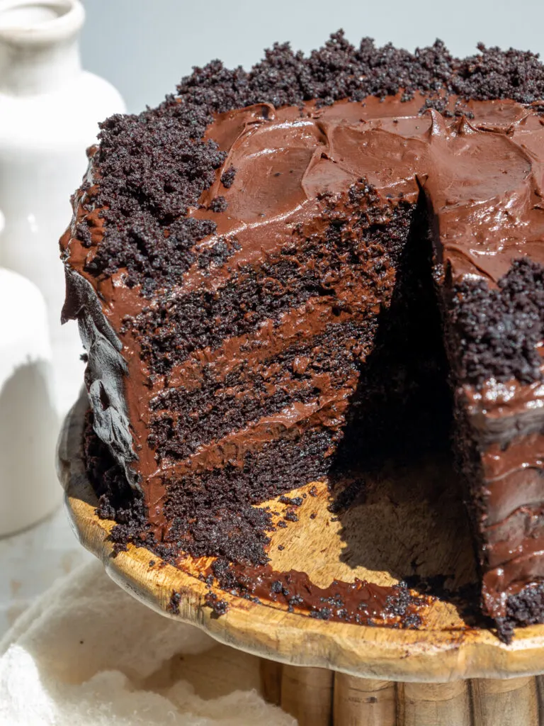 image of a death by chocolate cake that's been cut into to show how moist it is