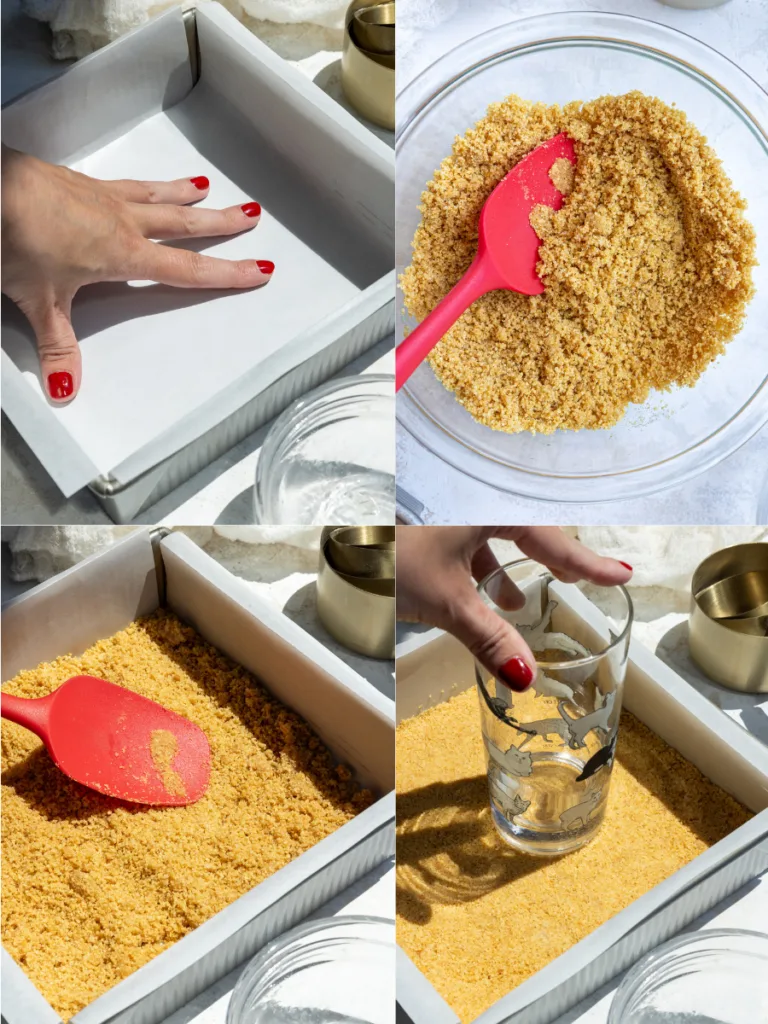 image of a graham cracker crust being pressed into a lined square metal pan