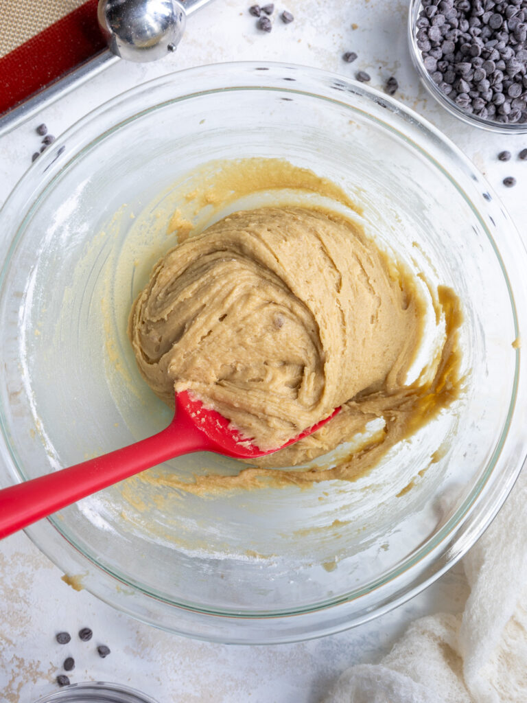 image chocolate chipless cookie dough in a glass bowl