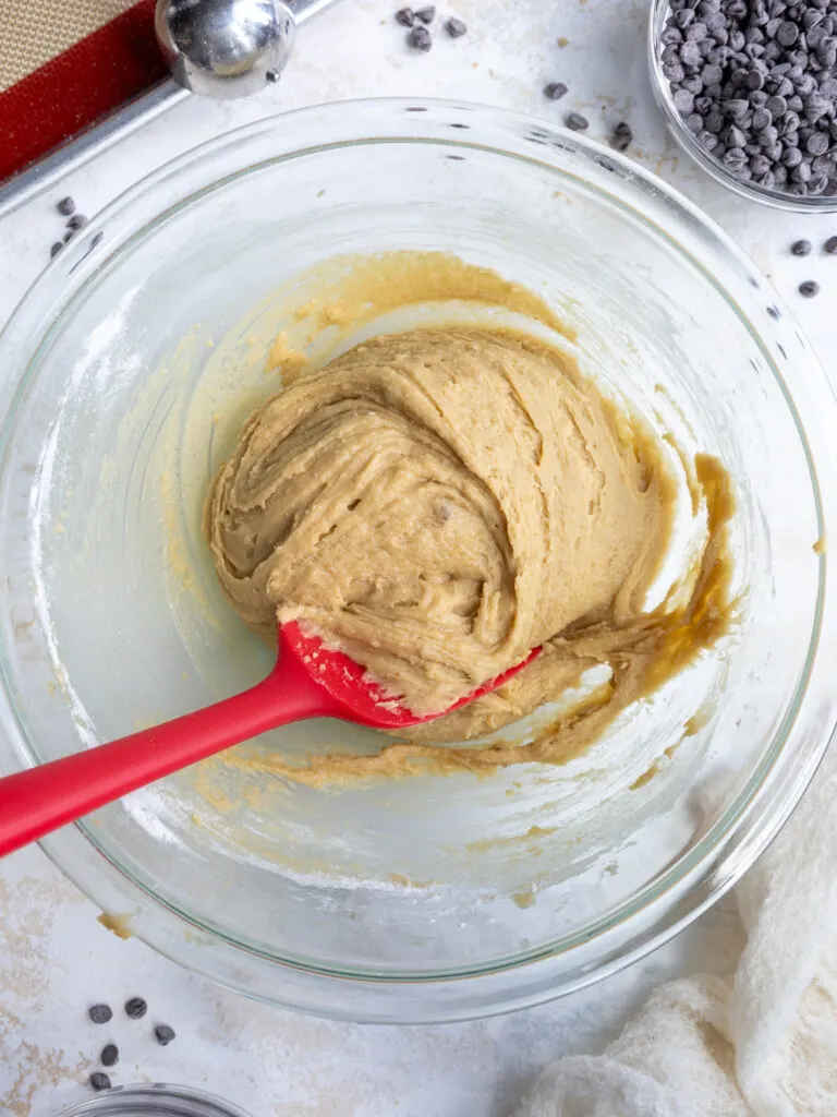 image chocolate chipless cookie dough in a glass bowl