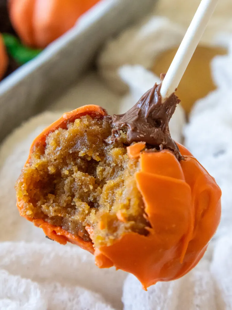 bitten into pumpkin shaped cake pop