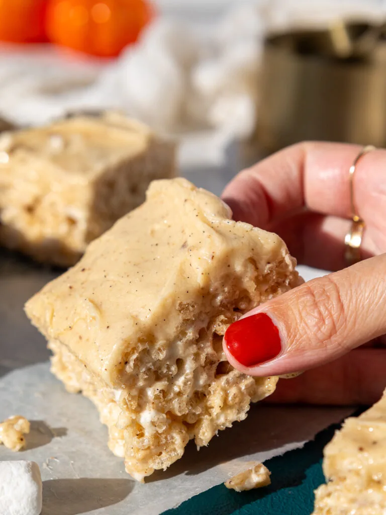 image of brown butter rice krispie treats being picked up