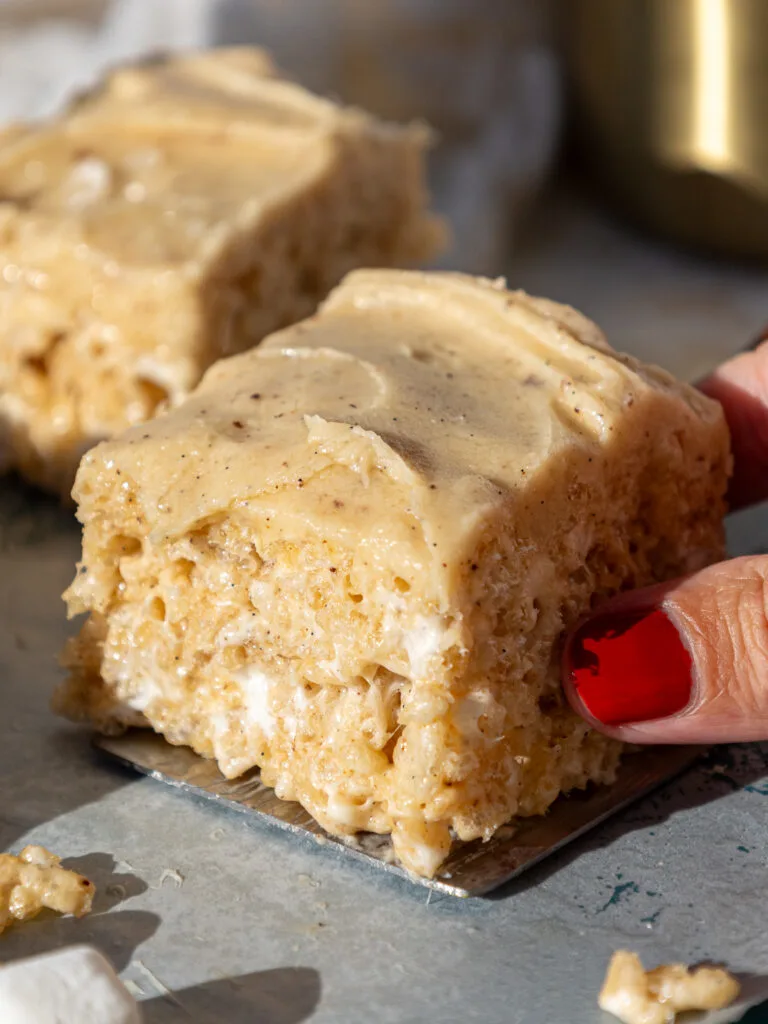 image of brown butter rice krispie treats being picked up