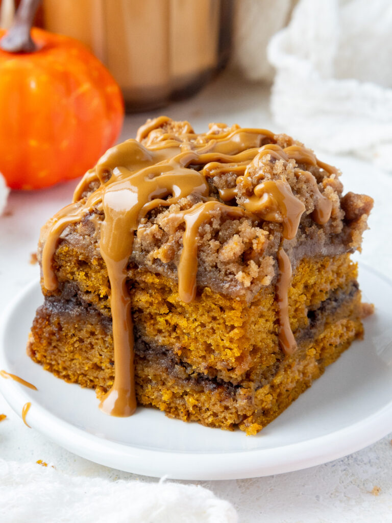 image of pumpkin coffee cake that's been topped with biscoff streusel and cookie butter