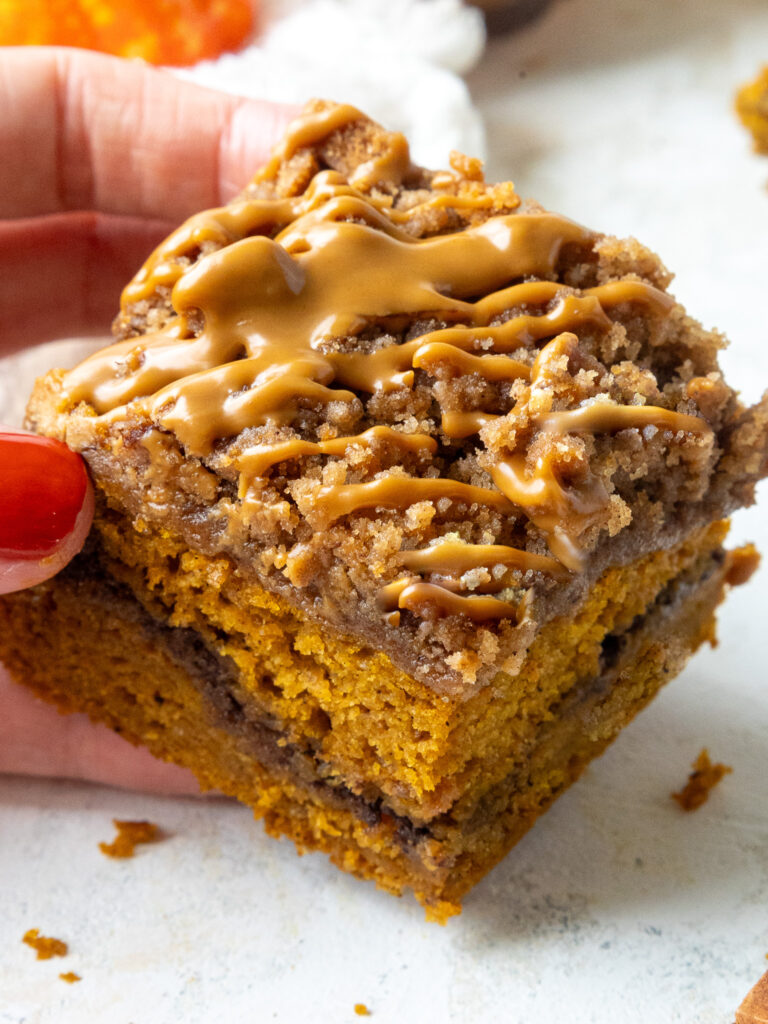 image of pumpkin coffee cake that's been topped with biscoff streusel and cookie butter