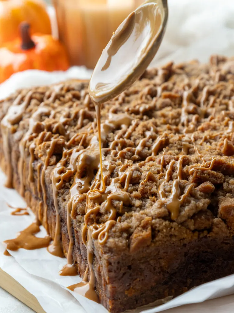 image of cookie butter being drizzled over a pumpkin coffee cake