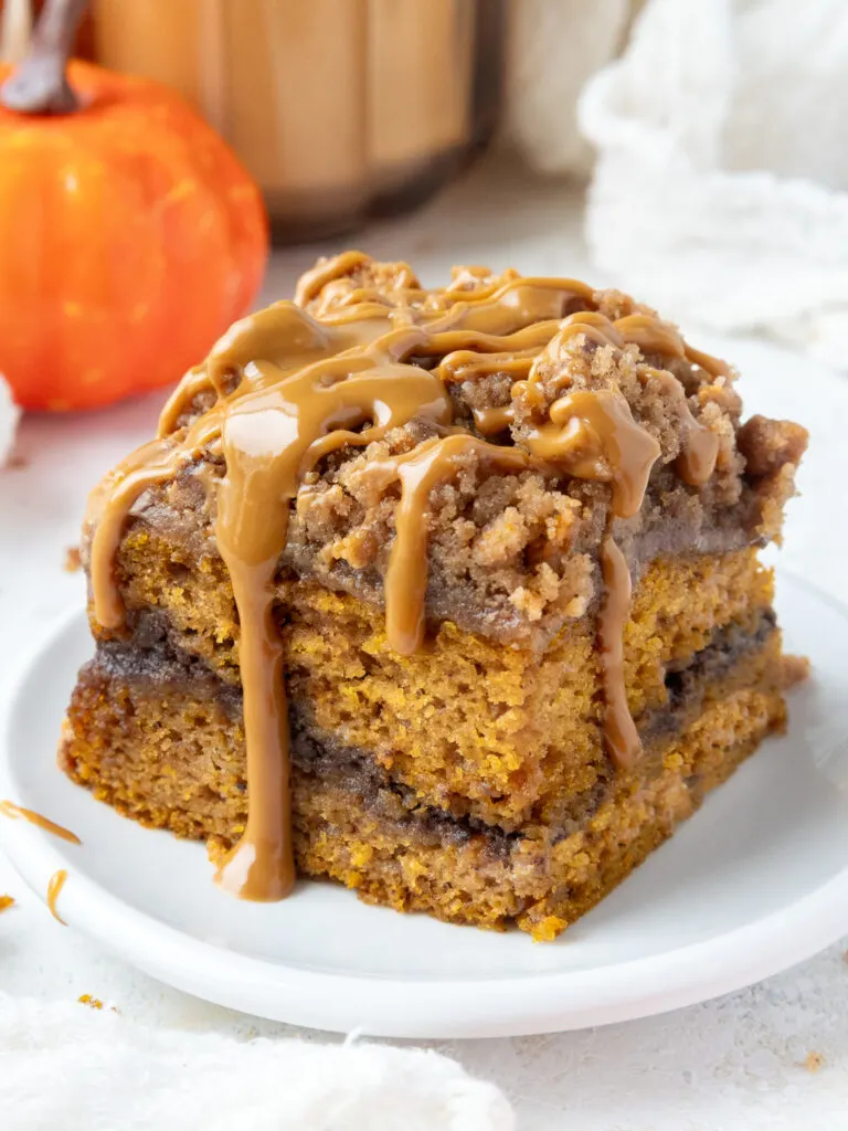 image of pumpkin coffee cake that's been topped with biscoff streusel and cookie butter