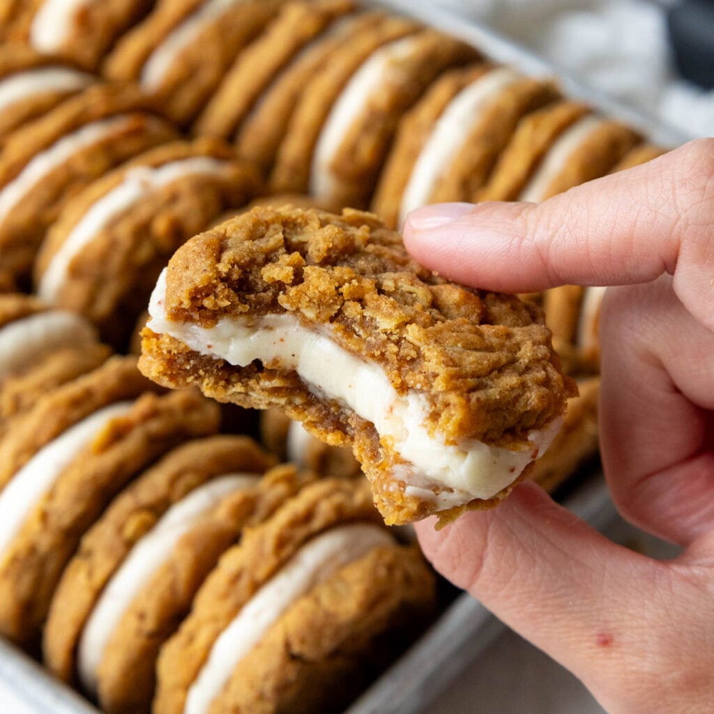 image of an oatmeal sandwich cookie filled with brown butter cream cheese frosting