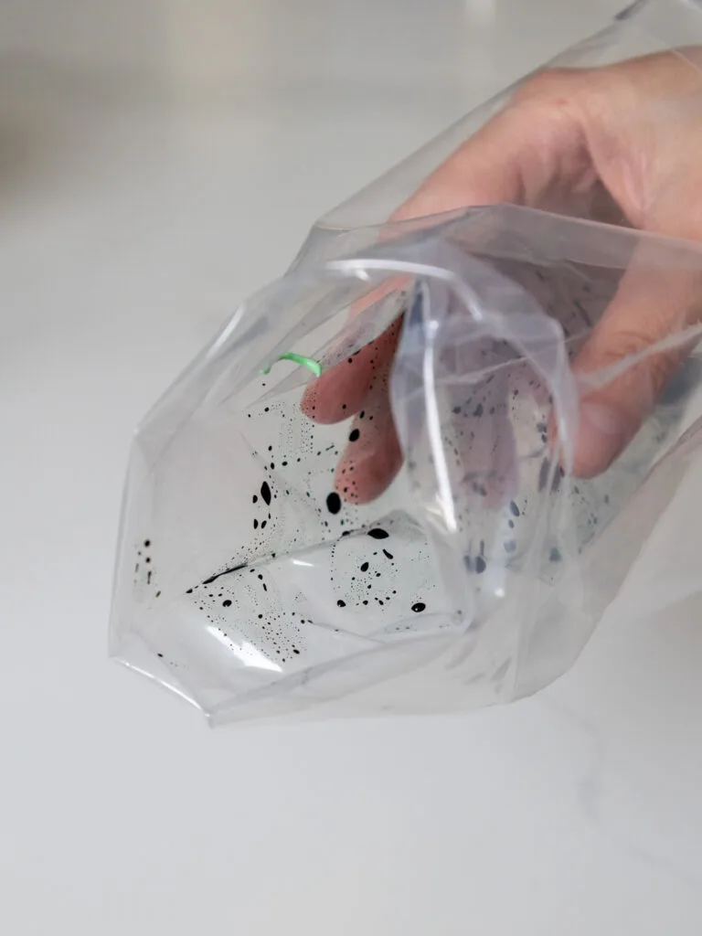 
image of a piping bag being brushed with gel food coloring