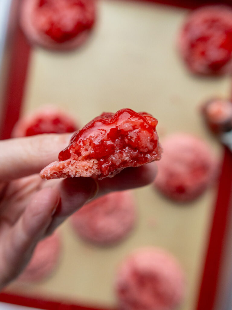 image of a strawberry sugar cookie that's been topped with a strawberry reduction