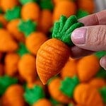 image of cute little carrot cookies that have been baked and are cooling on the baking sheet