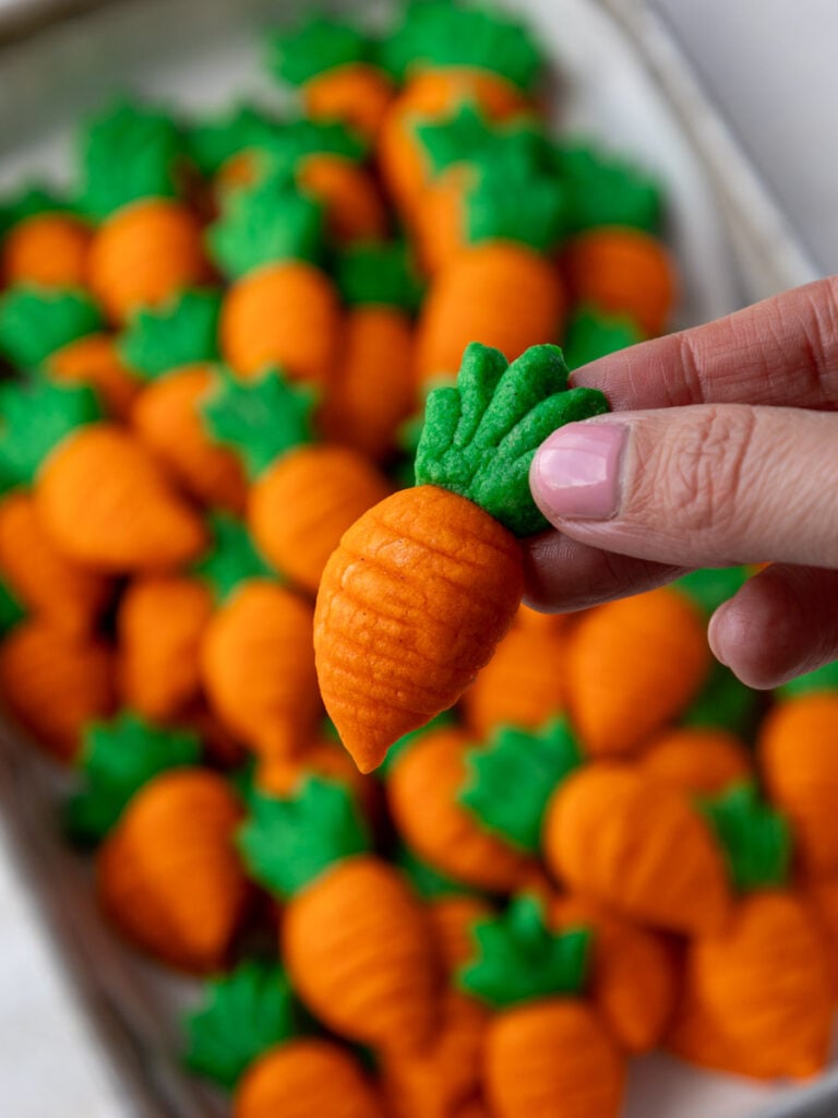 image of cute little carrot cookies that have been baked and are cooling on the baking sheet