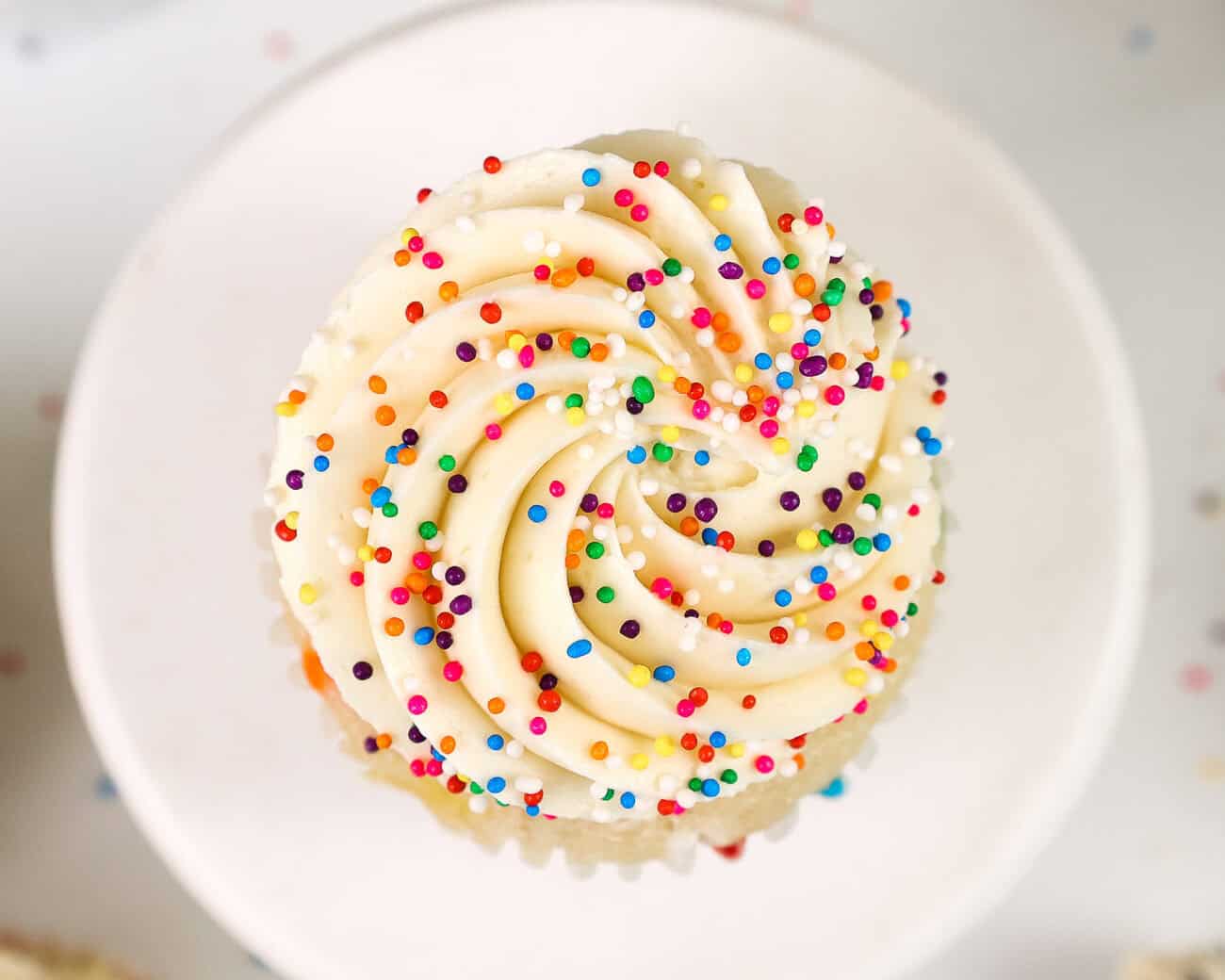 image of a cupcake frosted with perfectly sweet buttercream frosting