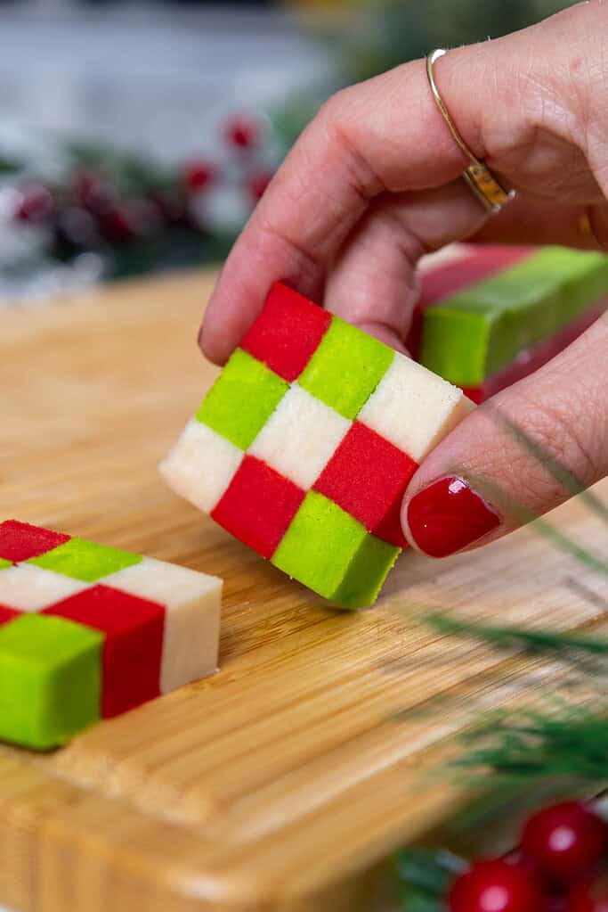 image of a checkerboard cookie that's been cut into and is ready to be placed on a baking sheet to be baked