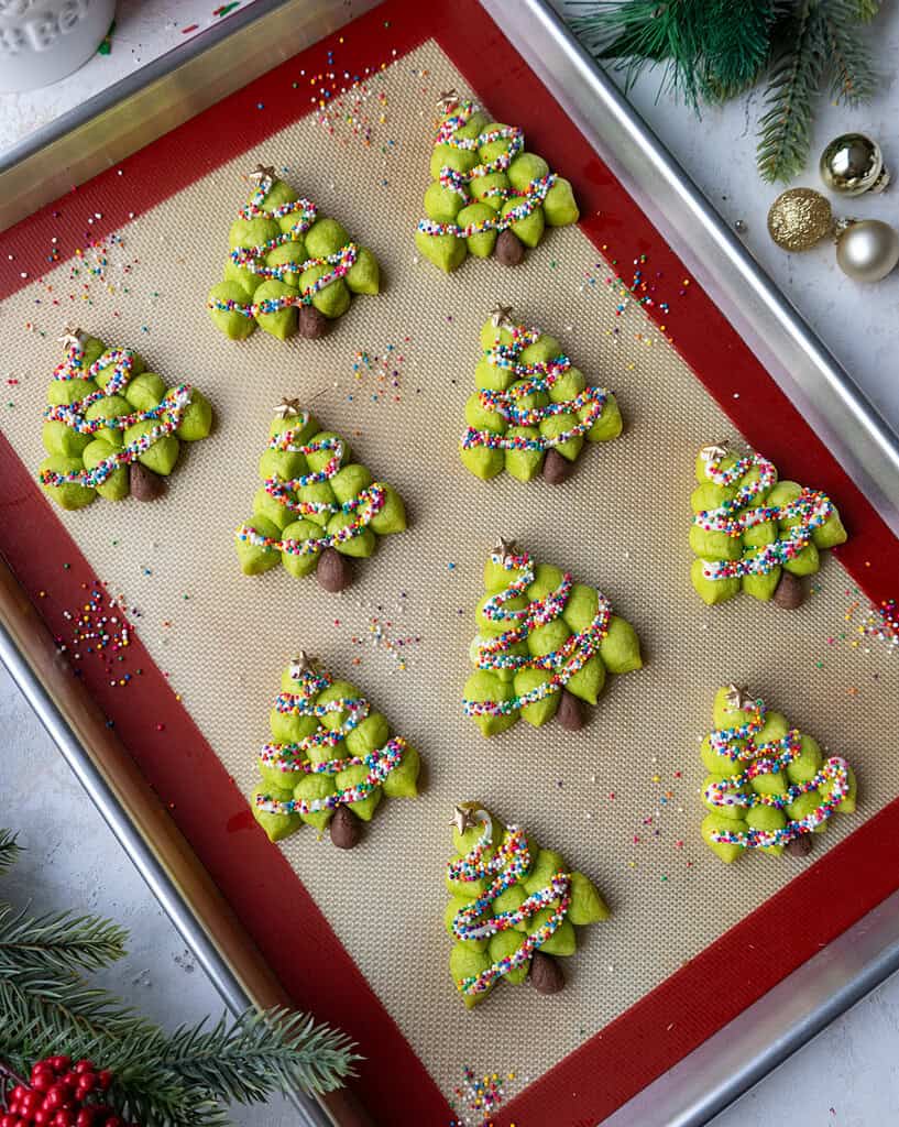 image of christmas tree cookies that have been decorated and are setting on a baking tray