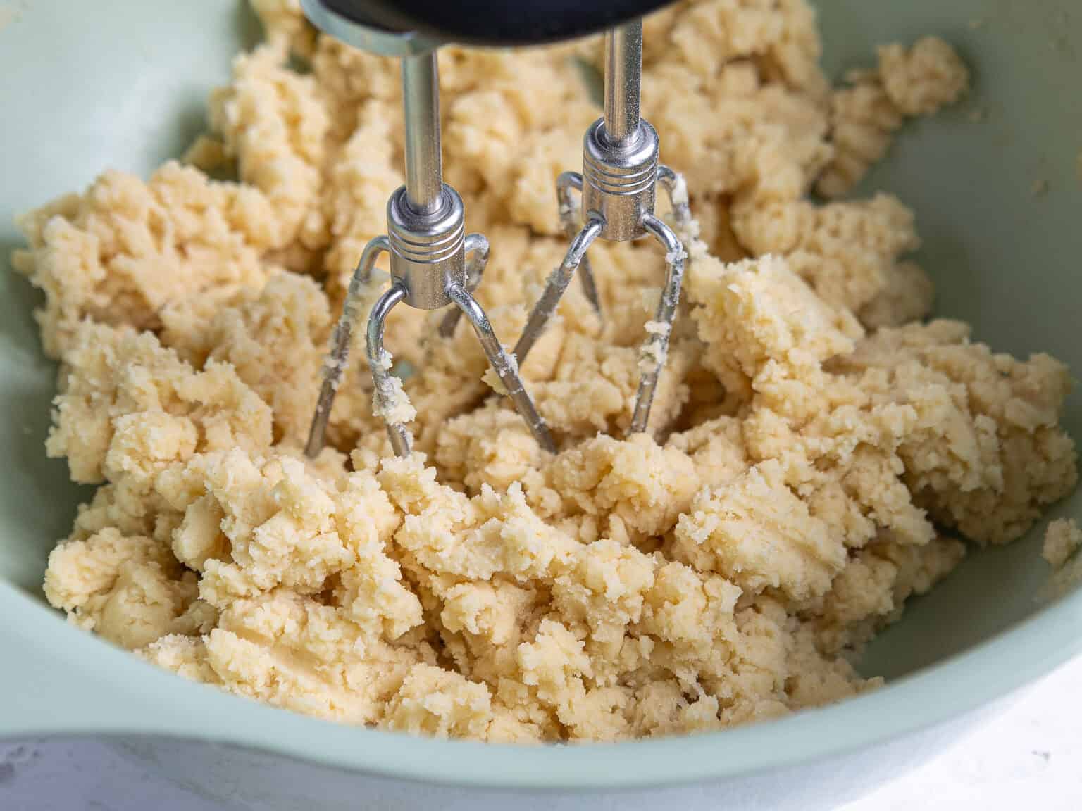 image of shortbread dough being mixed with an electric mixer