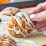image of a carrot cake cookie that's been drizzled with a cream cheese glaze