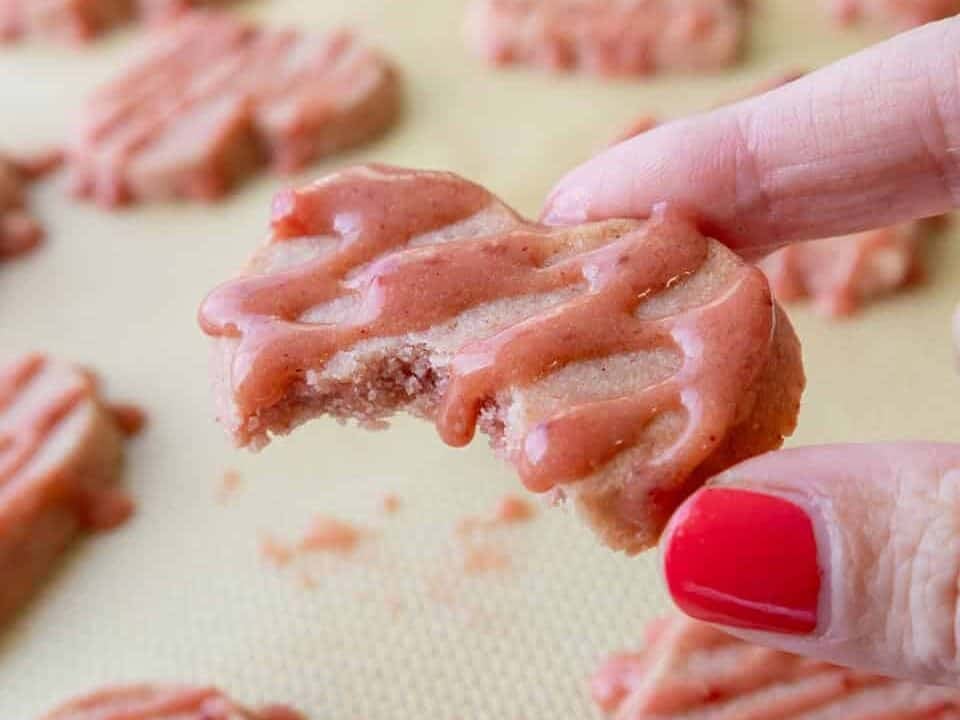 image of a strawberry shortbread cookie that's been bitten into