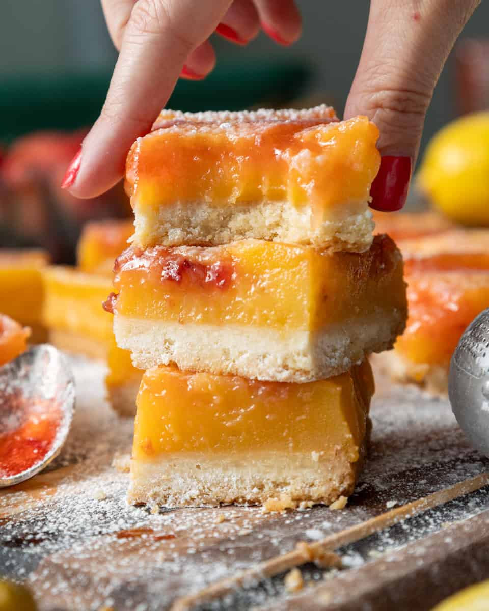 image of strawberry swirled lemon bars that have been stacked