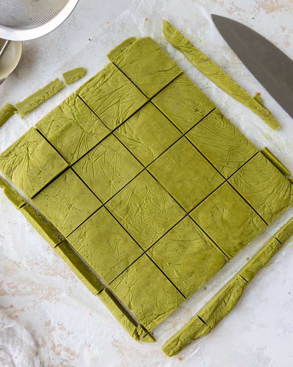 image of matcha shortbread cookie dough that's been cut to make Frankenstein cookies