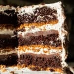 image of a smores cake that's been filled with milk chocolate ganache and toasted meringue buttercream
