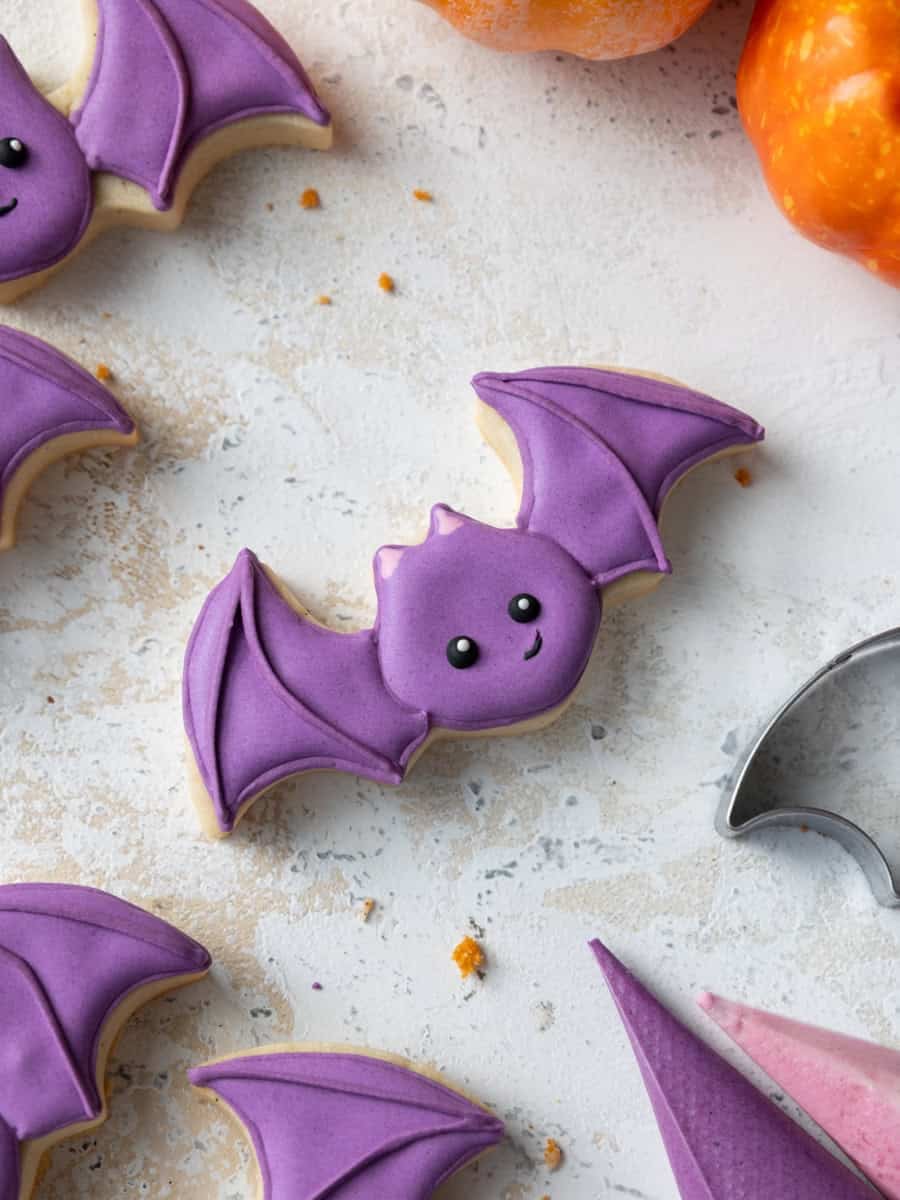 image of a purple bat cookie that's been decorated with royal icing 