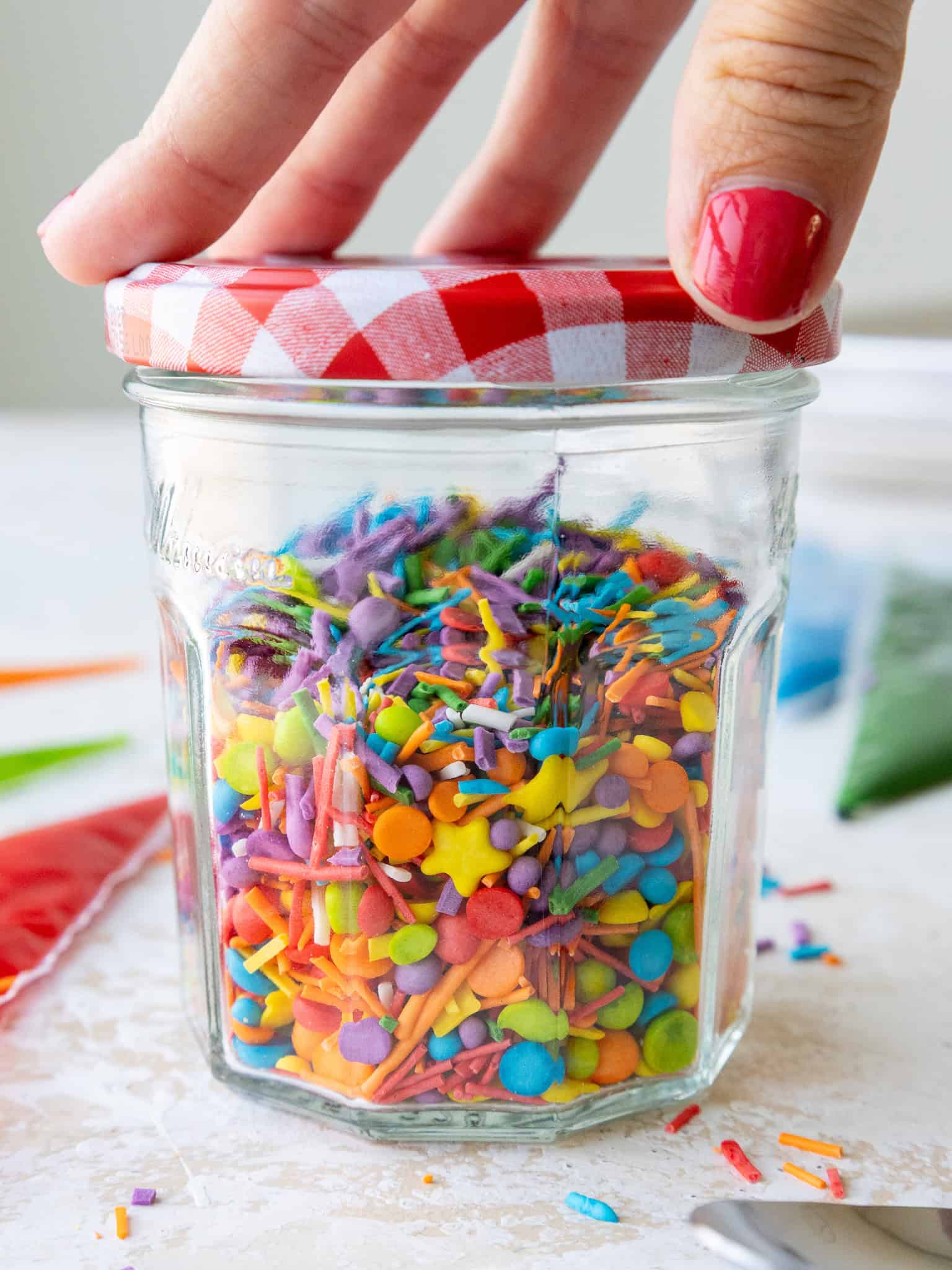 image of homemade sprinkles that have been poured into a jar to be stored