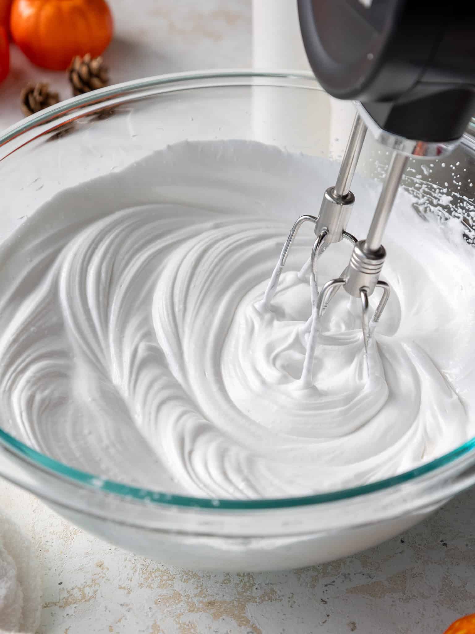 French meringue being mixed with a hand mixer