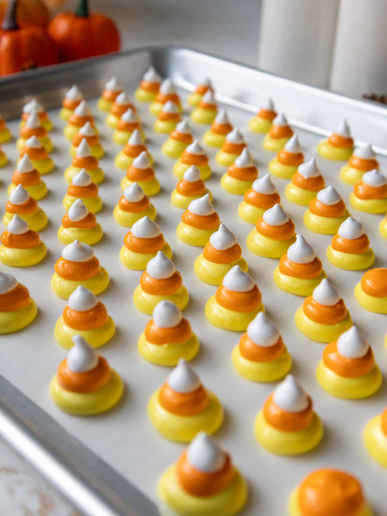 image of candy corn meringues being piped