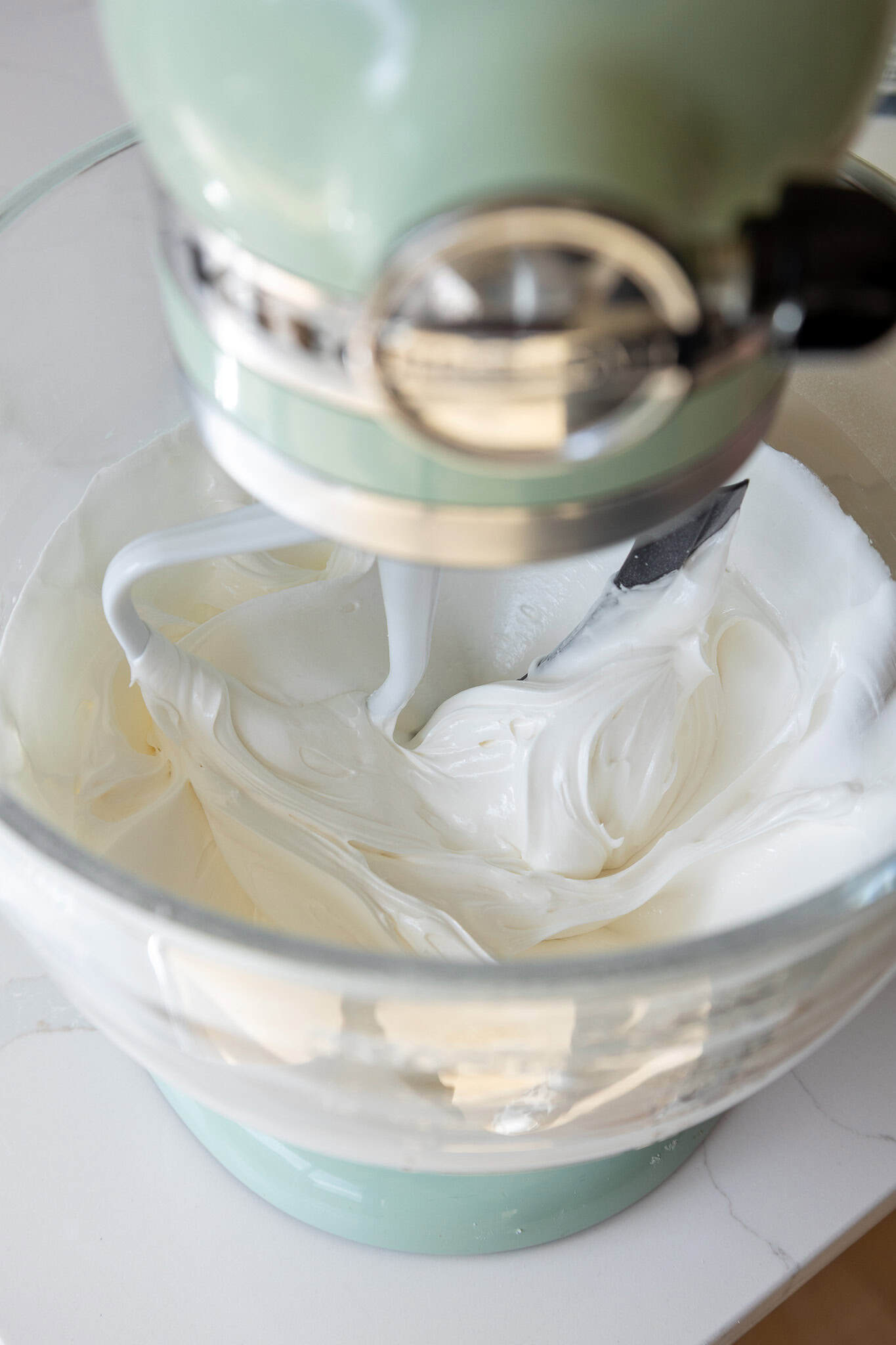 image of royal icing being made in a stand mixer