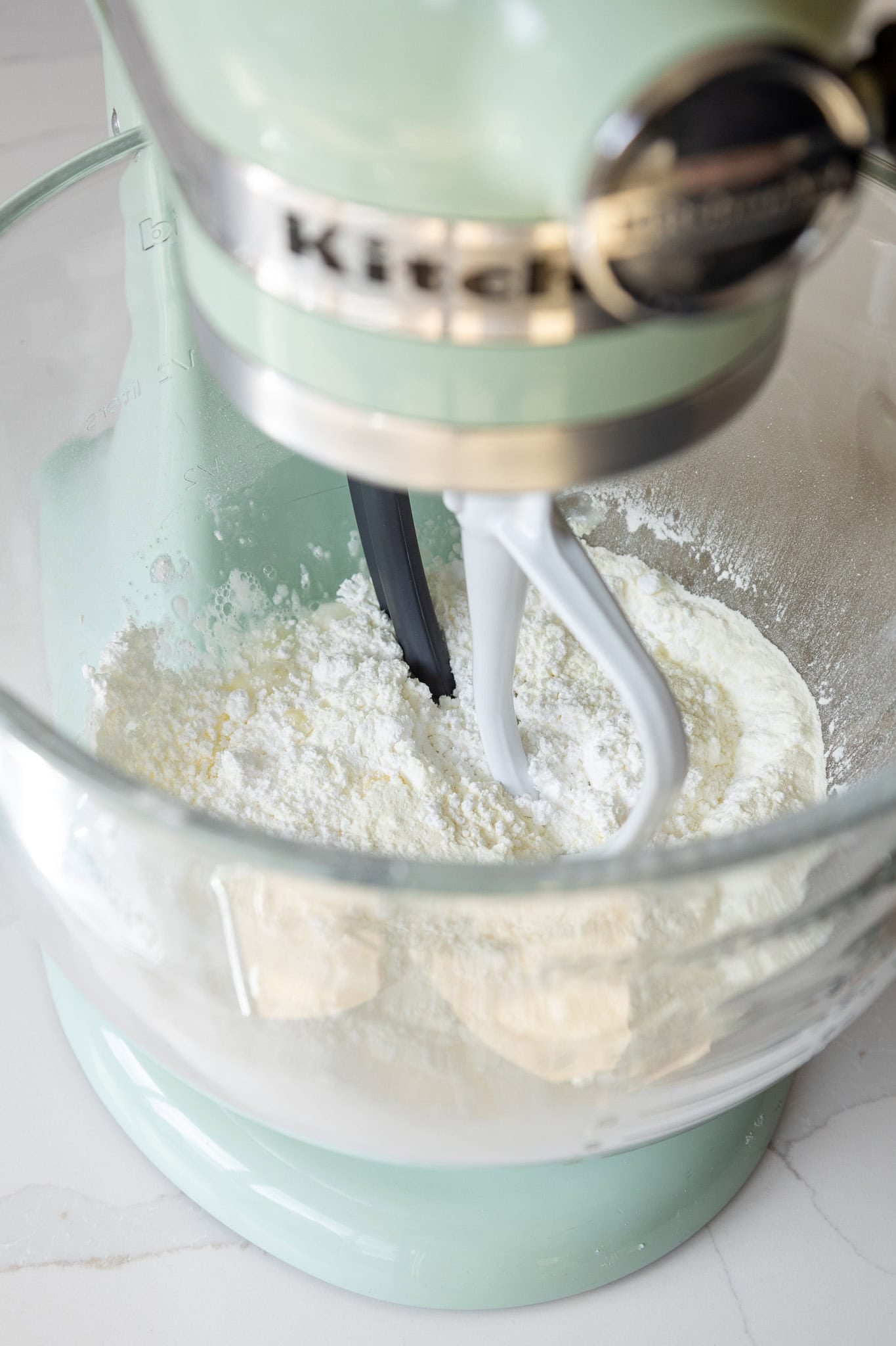 image of royal icing being made in a stand mixer