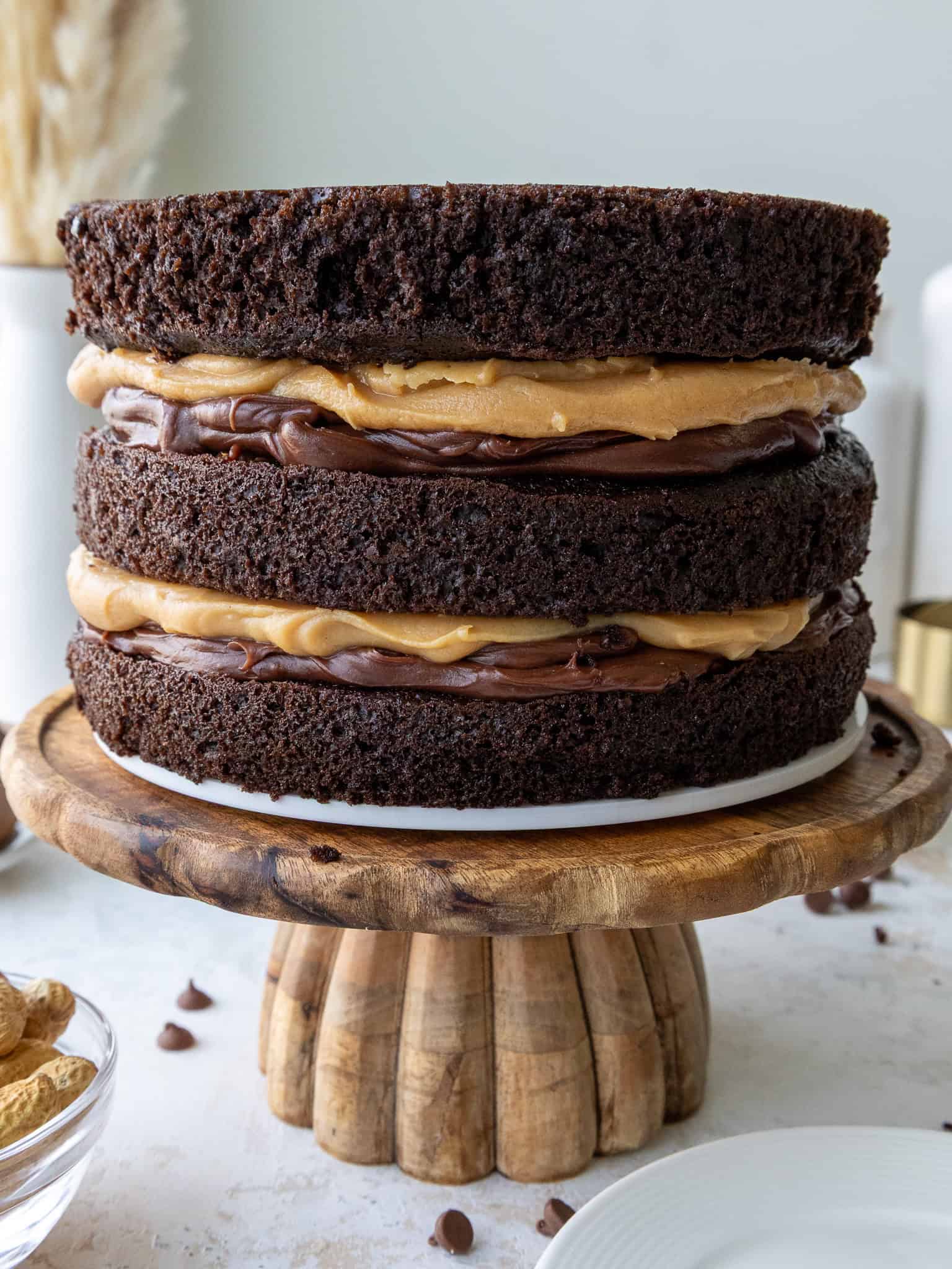 image of a peanut butter fudge cake that's been stacked and is ready to be frosted