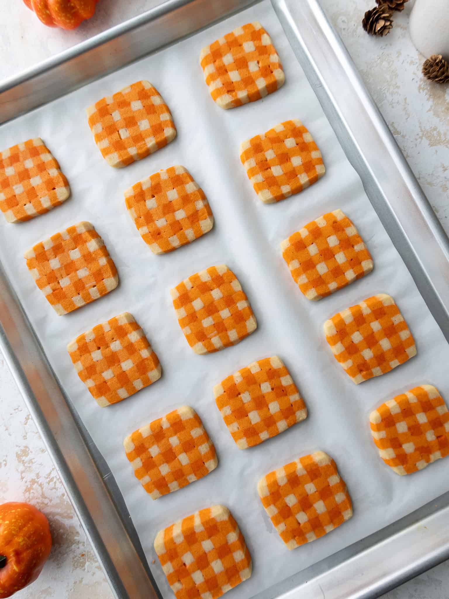 image of gingham shortbread cookies that have been baked on a metal pan